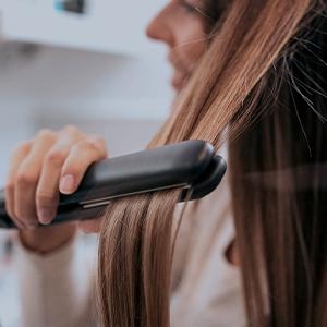 peace of mind; girl straightening hair